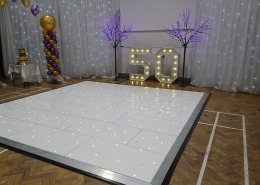 individual light up letters numbers 5 0 50 pink blossom tree and led backdrop white led dancefloor