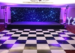 portsmouth marriott hotel individual letters bhlack and white dancefloor stage black starcloth puirple uplighters and stage lighting